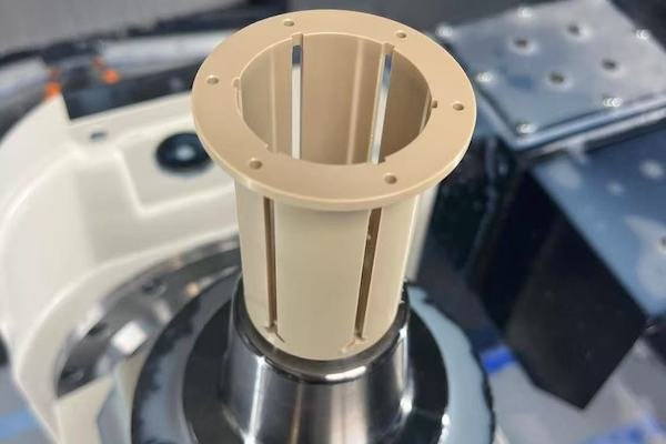 PEEK plastic part machined on a CNC milling setup