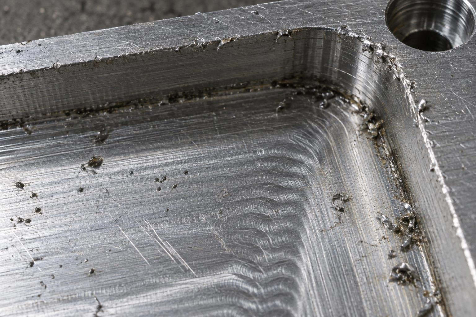 8 Major CNC Machining Defects Analysis: Causes, Solutions and Prevention 8 CNC milled aluminum pocket with rough surface finish burrs and chatter marks
