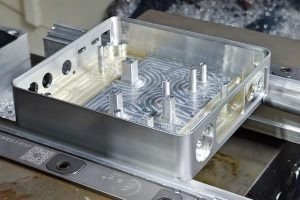 CNC machined aluminum electronics enclosure with internal pockets and mounting bosses